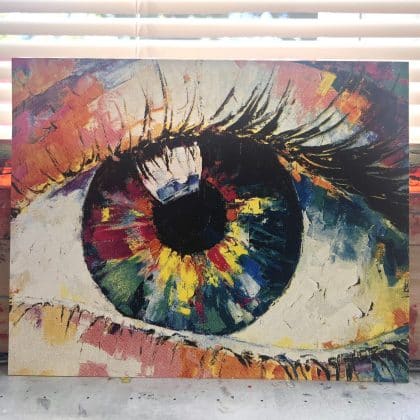 CMYK Eye Painting screen print standing upright, featuring a realistic eye created with cyan, magenta, yellow, and black halftone layers.