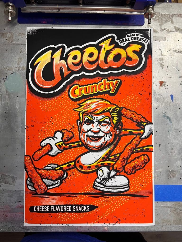 Full view of hand-pulled screen printed artwork featuring a satirical snack bag illustration with a reimagined presidential portrait, printed in bold layered inks.